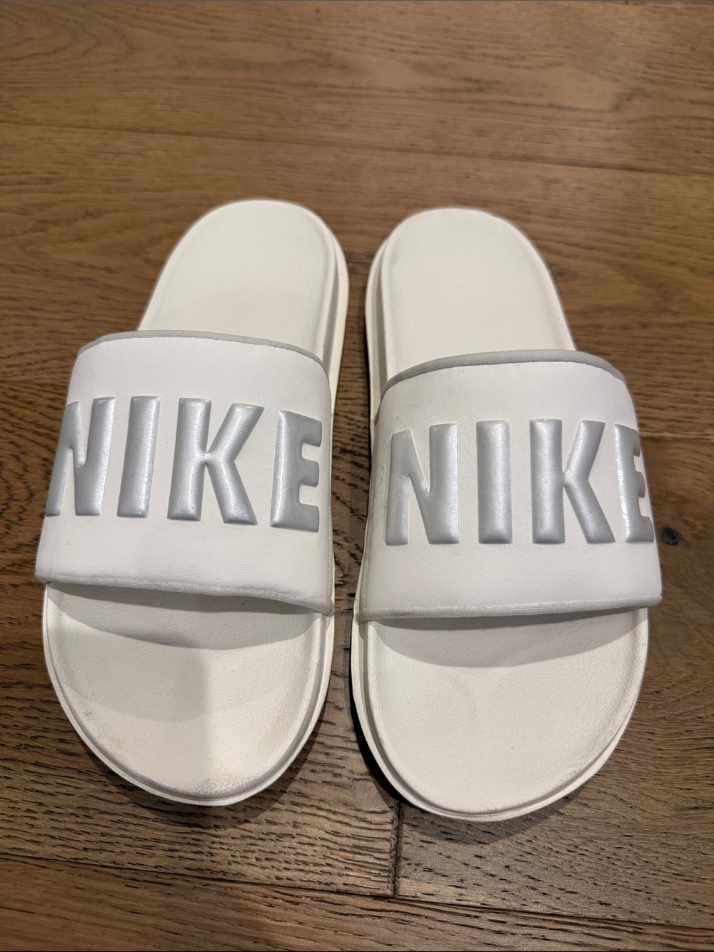 Nike White Slide Sandals with Silver NIKE Logo